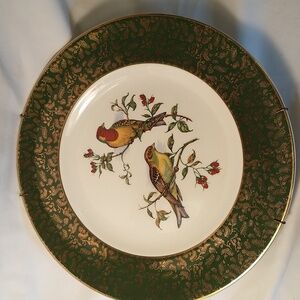 Vintage Woods & Sons decorative plate with a pair of colorful Buntings